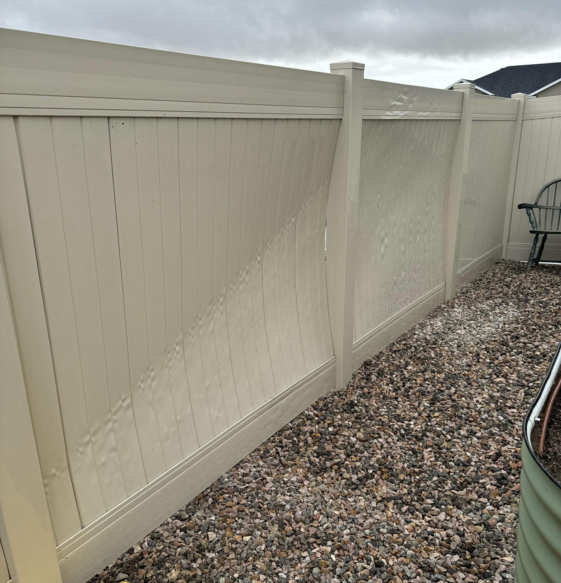 Warped and distorted vinyl fence line.