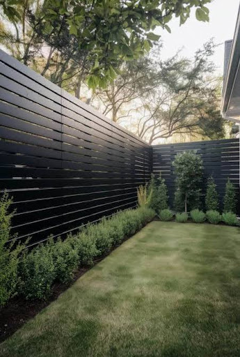 Sleek black aluminum semi-privacy fence by PrimeAlux delivering ornamental look similar to wrought iron fence